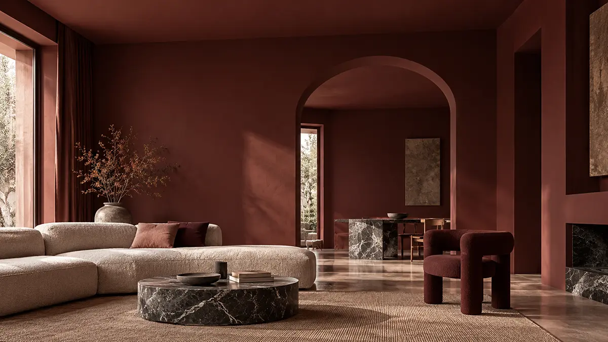 Composizione di pietre naturali, legno e tessuti su sfondo terracotta, tra colore e materia.